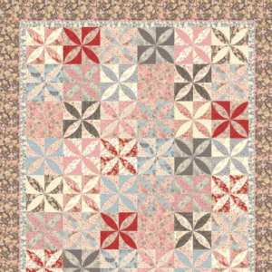 Papillon free quilt pattern by 3 Sisters for Moda Fabrics featuring colorful petal-shaped pinwheel blocks in soft pink, dusty blue, red, gray, and cream floral fabrics.