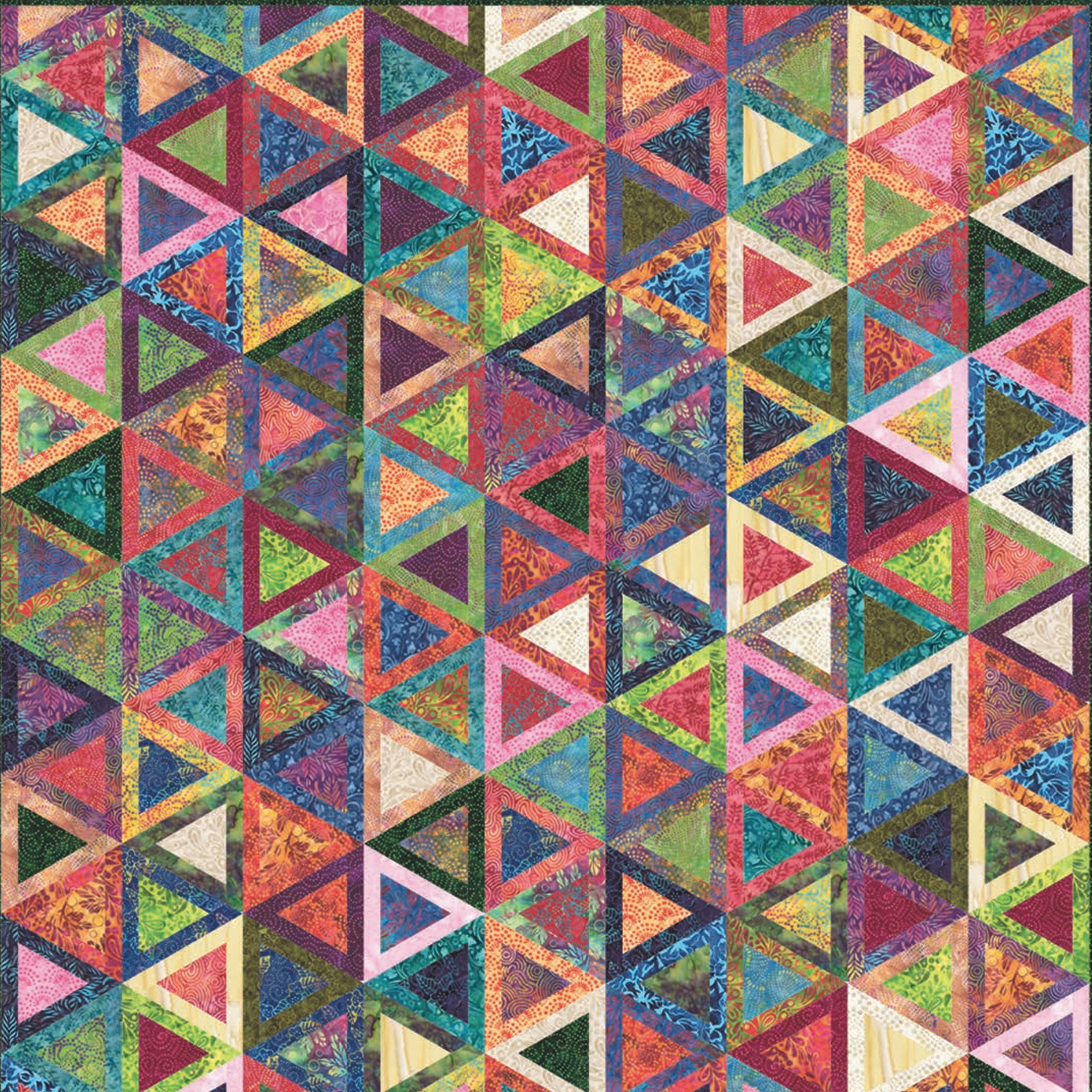 Wild Waves Batiks free quilt pattern by Moda Fabrics, featuring a vibrant geometric triangle design in colorful batik fabrics with shades of turquoise, purple, pink, orange, green, red, and blue.